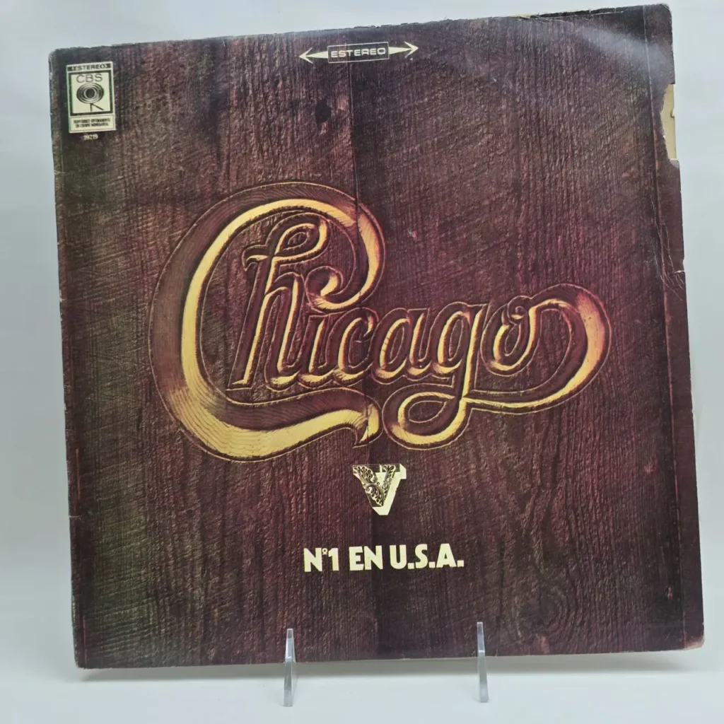 Portada de álbum de vinilo de Chicago con logo dorado y textura de madera, indicando "N°1 EN U.S.A.". by Remates Narvaja