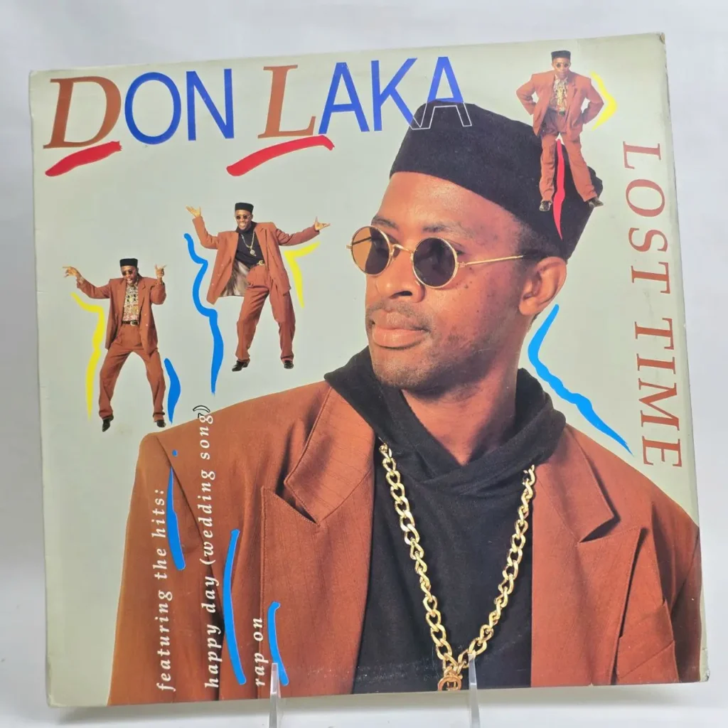 Don Laka Lost Time album cover con hombre en gafas de sol, traje y cadena de oro. by Remates Narvaja