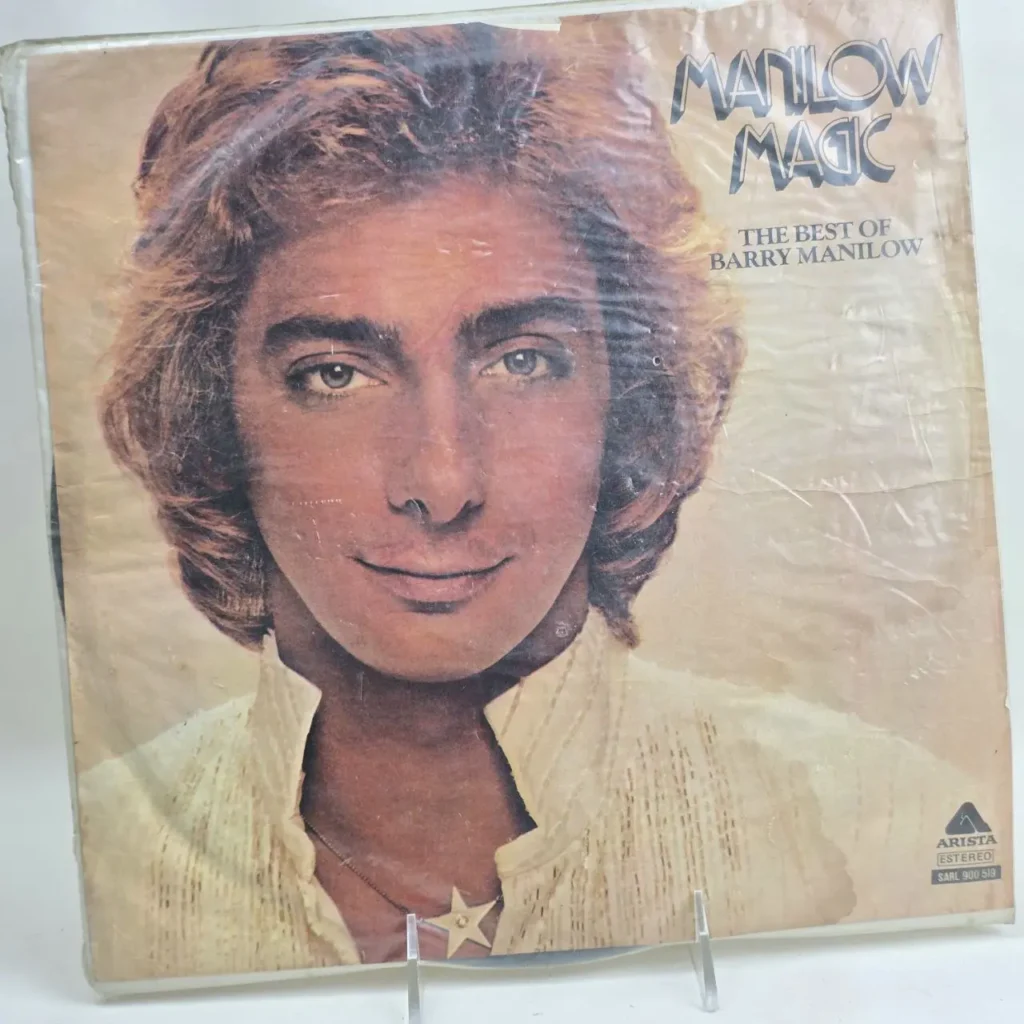 Portada del álbum "Manilow Magic: The Best of Barry Manilow" con el rostro de Barry Manilow. by Remates Narvaja