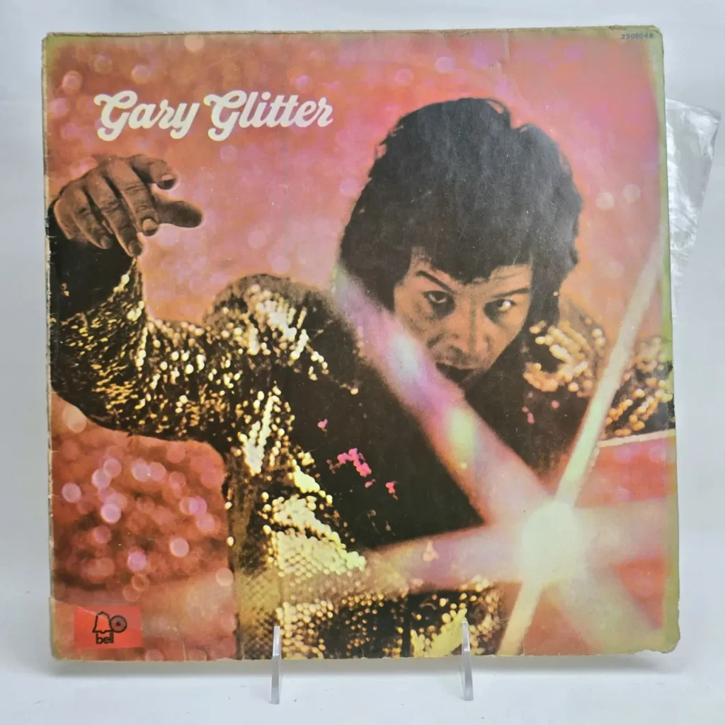 Portada del álbum de vinilo de Gary Glitter con chaqueta de lentejuelas y fondo brillante, sello Bell Records. by Remates Narvaja