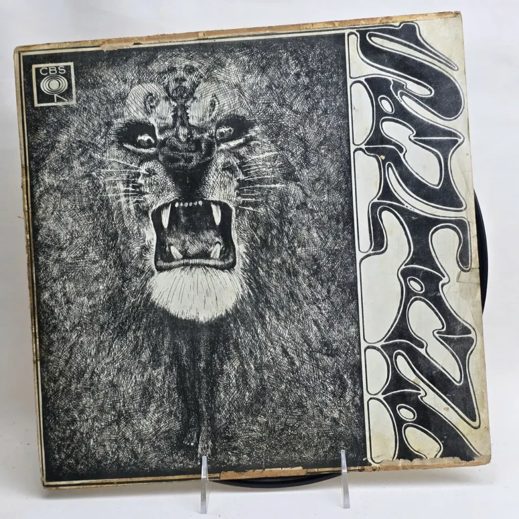 Portada de álbum de vinilo de Santana con ilustración en blanco y negro de un león rugiendo y el nombre "Santana" en tipografía estilizada by Remates Narvaja