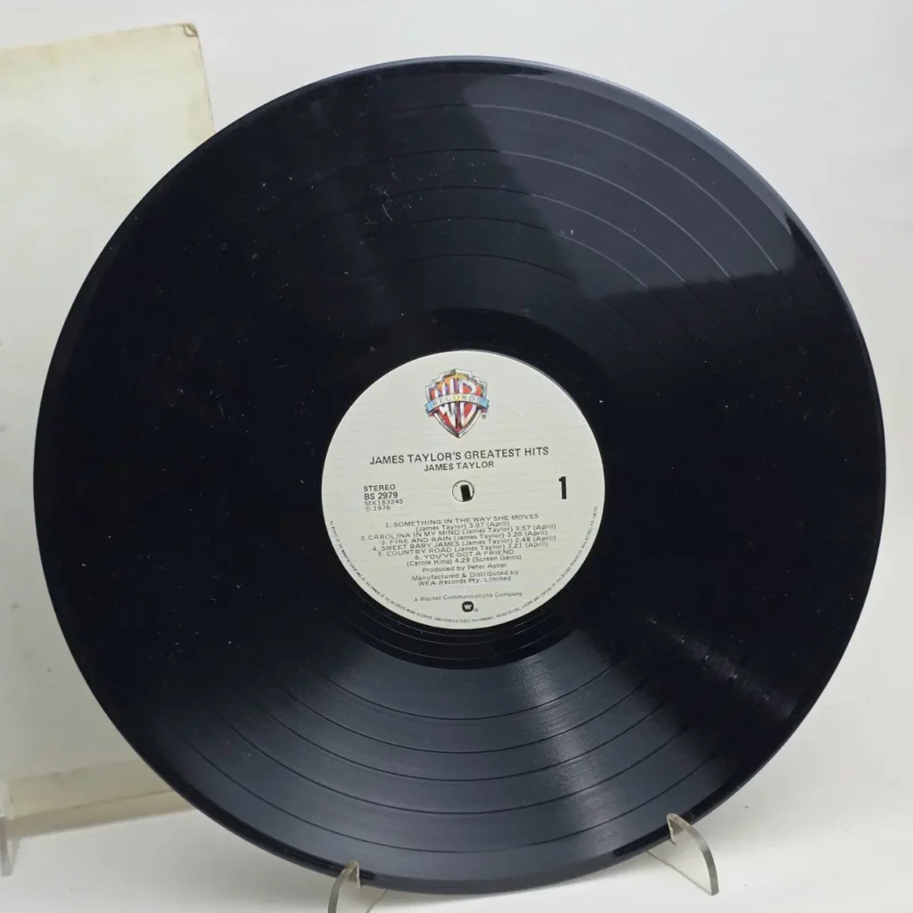 Disco de vinilo negro de James Taylor's Greatest Hits, lado 1, sello Warner Bros. by Remates Narvaja