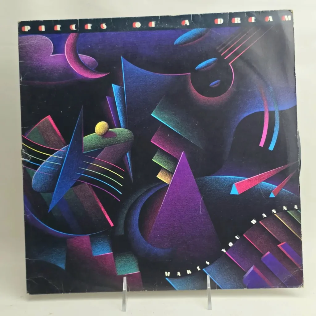 Carátula del álbum "Pieces of a Dream - Makes You Wanna" con arte abstracto geométrico de colores neón, guitarra y teclado de piano. by Remates Narvaja