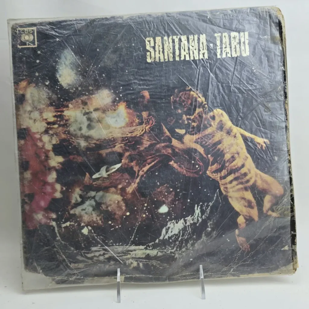 Santana Tabu vinyl album cover con arte cósmico y figura. by Remates Narvaja