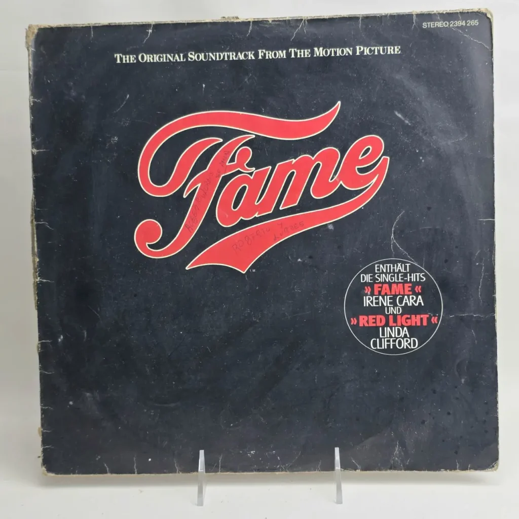 Fame movie soundtrack vinyl record album cover, black with red title, featuring Irene Cara. by Remates Narvaja