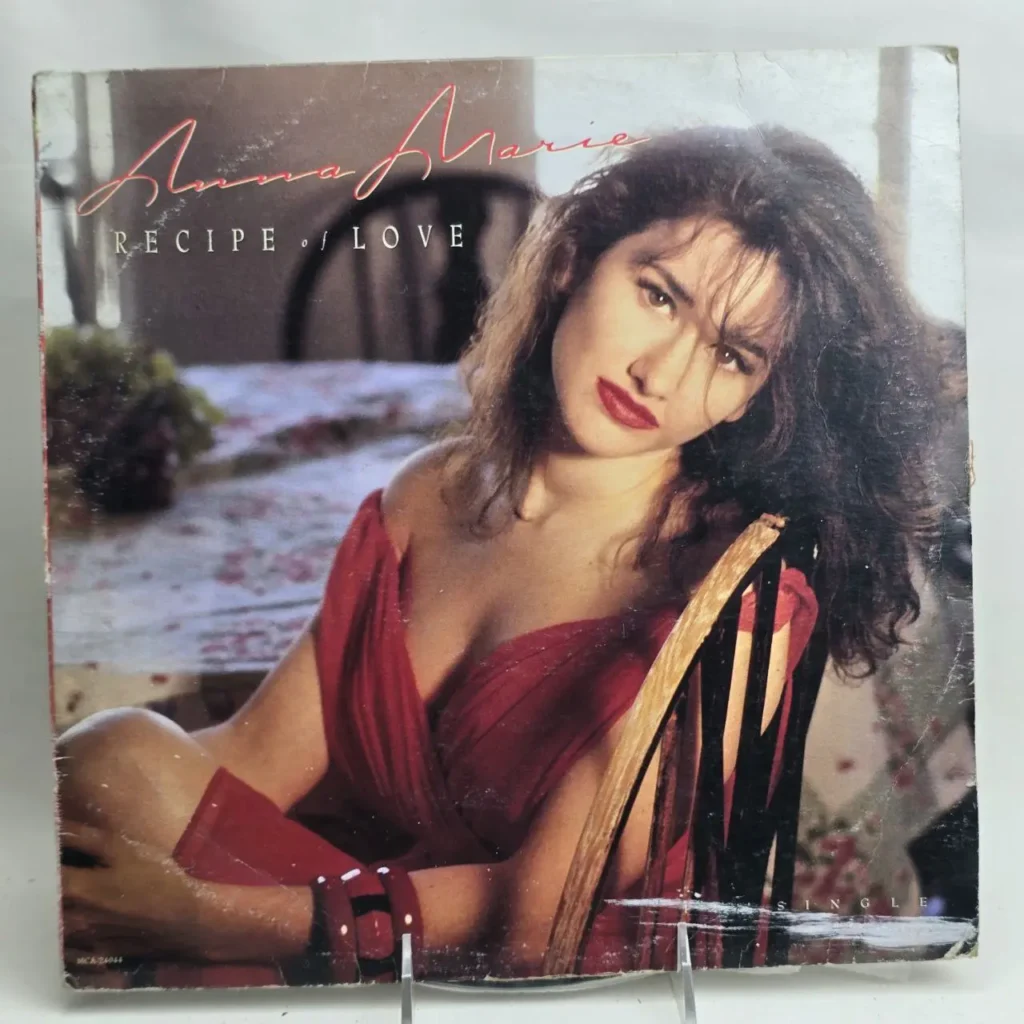 Portada del single Anna Marie Recipe of Love con una mujer en vestido rojo. by Remates Narvaja