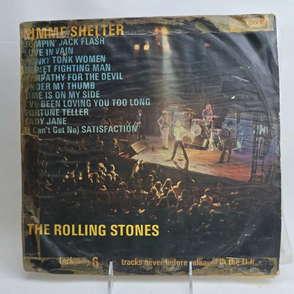 Portada del álbum The Rolling Stones Gimme Shelter con la banda en vivo y la lista de canciones. by Remates Narvaja