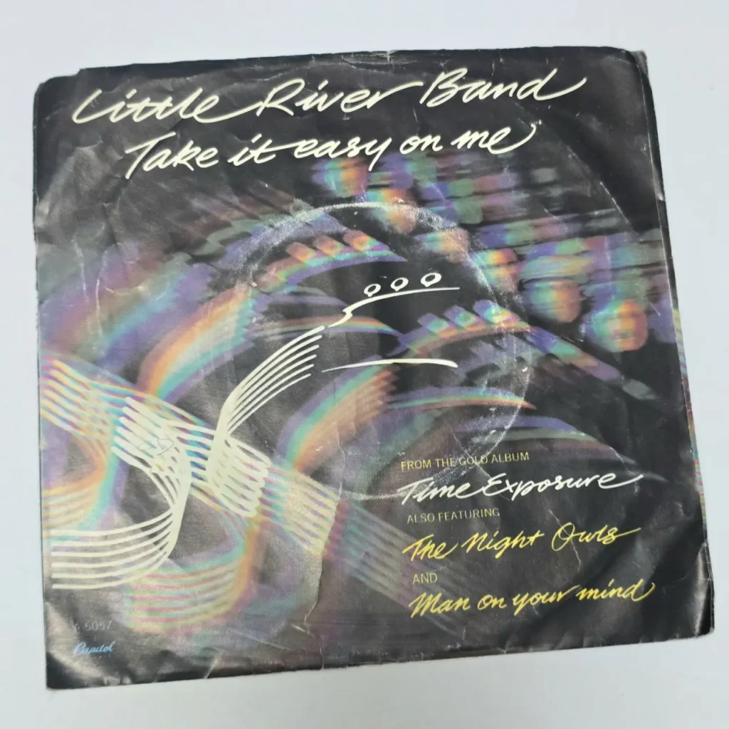 Sencillo de Little River Band 'Take It Easy On Me' con diseño abstracto de arcoíris, del álbum 'Time Exposure'." by Remates Narvaja