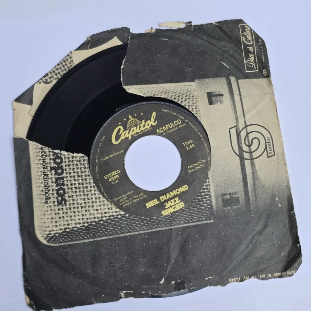 Vinilo 7 pulgadas Neil Diamond "Acapulco" / "Jazz Singer" de Capitol Records (1980) en funda desgast by Remates Narvaja