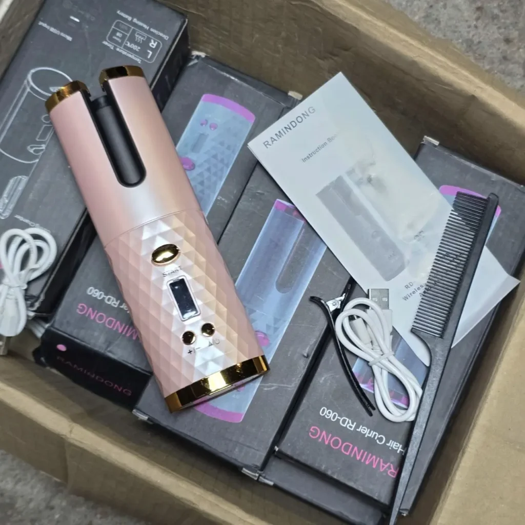 Rizador de pelo automático RAMINDONG RD-060 color oro rosa con peine y cable de carga. by Remates Narvaja