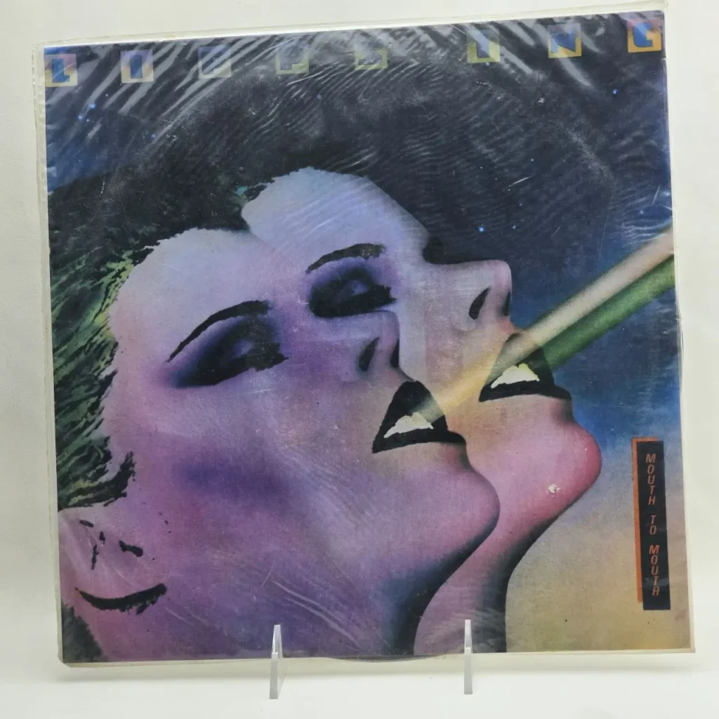Portada del álbum de vinilo Lipps Inc. Mouth to Mouth con dos rostros estilizados en tonos morados y rosados, fondo estrellado y by Remates Narvaja
