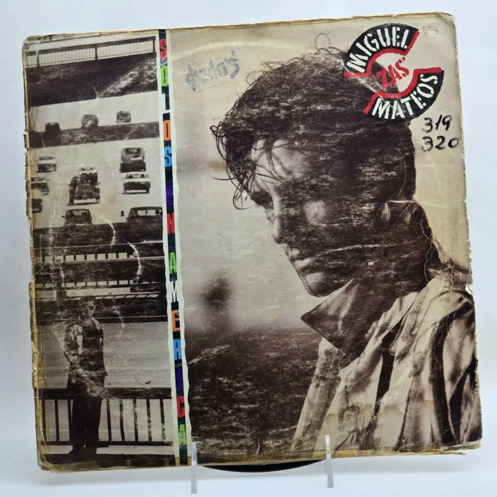 Carátula de vinilo desgastada de Miguel Zas Mateos - SOS, con retrato en blanco y negro del artista y escena urbana. by Remates Narvaja