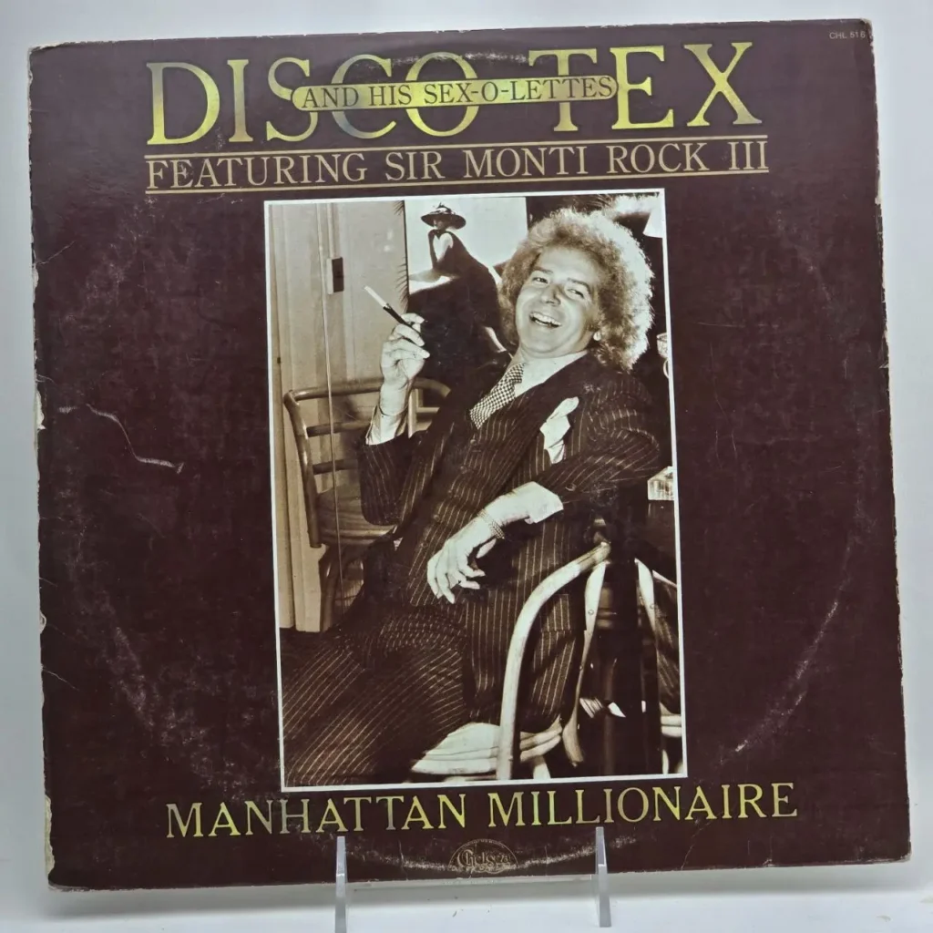 Portada de álbum "Disco and His Sex-o-lettes - Manhattan Millionaire" con Sir Monti Rock III, mostrando un hombre sonriente en traje by Remates Narvaja