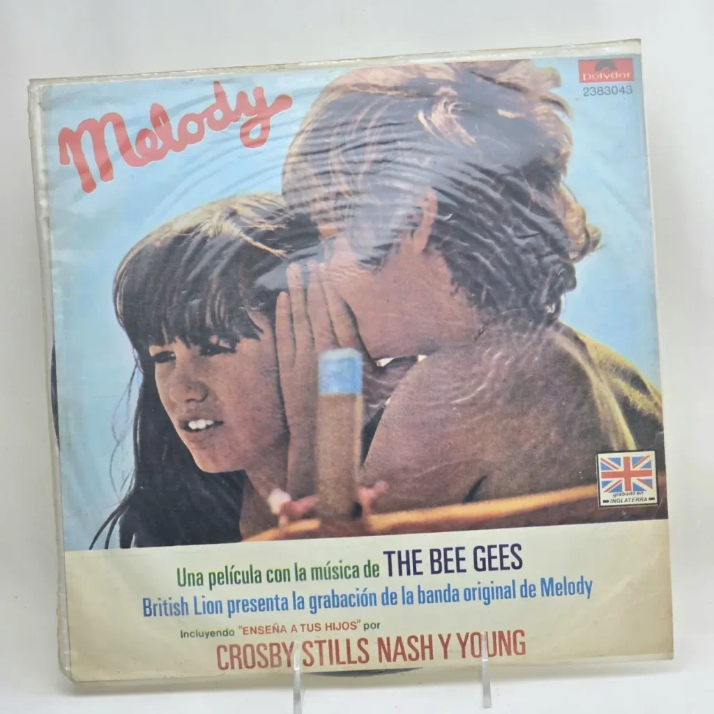 Portada de álbum de vinilo Melody con dos niños susurrándose, música de The Bee Gees y Crosby Stills Nash y Young by Remates Narvaja