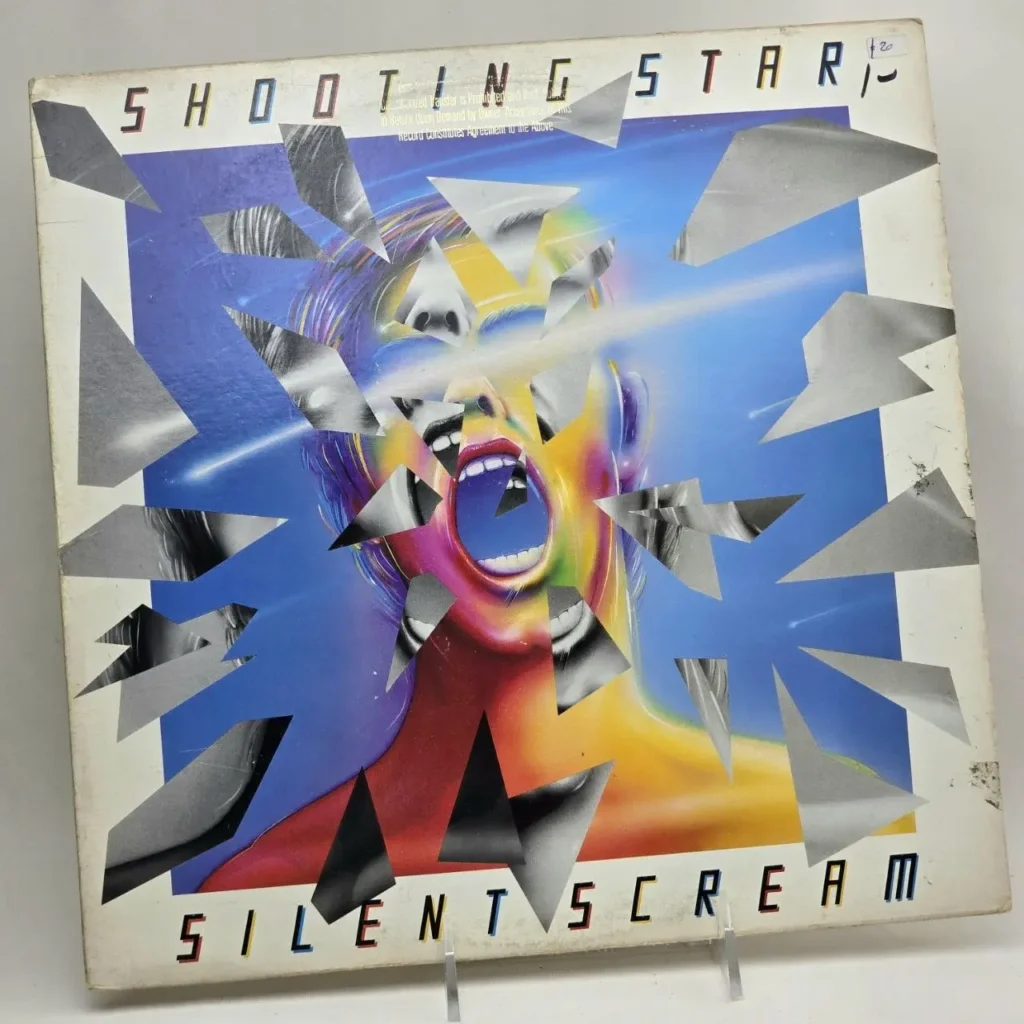 Portada del álbum Shooting Star Silent Scream con cara gritando, rayos de luz y diseño fragmentado. by Remates Narvaja