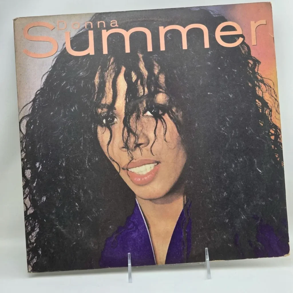 Portada de vinilo de Donna Summer con retrato de la cantante, cabello rizado y sonrisa. by Remates Narvaja