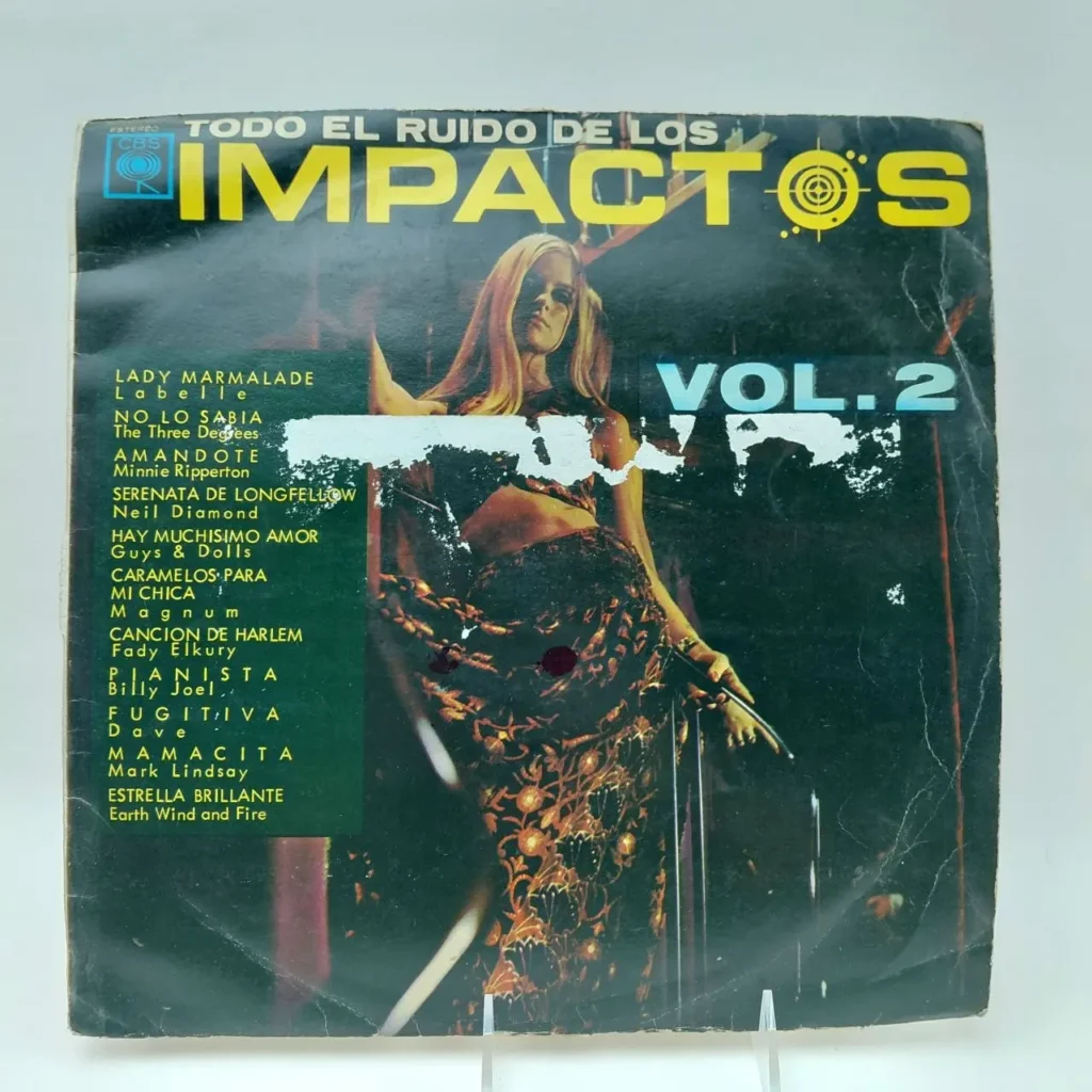 Portada del álbum "Todo el Ruido de los Impactos Vol. 2" con una mujer bailando y lista de canciones como "Lady Marmalade" by Remates Narvaja