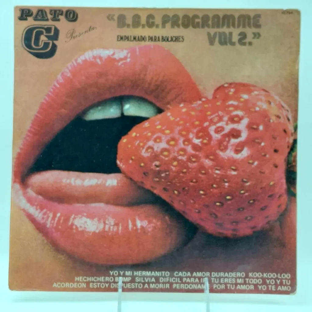 Cubierta de álbum "PATO C presenta B.B.C. PROGRAMME VOL 2" con labios rojos y una fresa, y la by Remates Narvaja