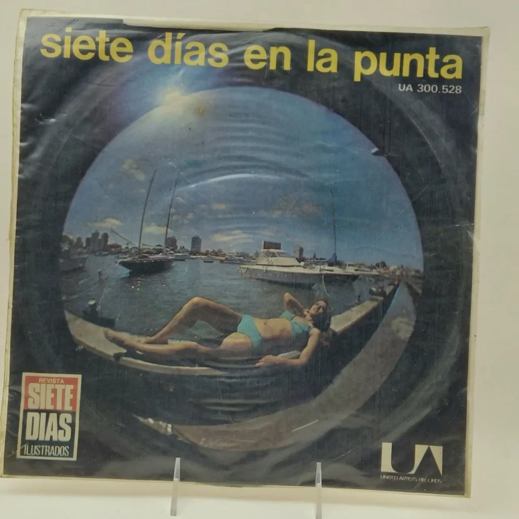 Portada de disco "Siete Días en la Punta" con mujer en bikini en un puerto. by Remates Narvaja