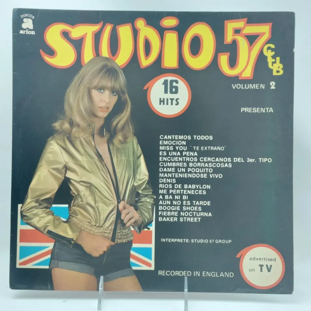 Portada de álbum de vinilo Studio 57 Volumen 2 con 16 éxitos, mostrando a una mujer rubia en chaqueta dorada y shorts by Remates Narvaja