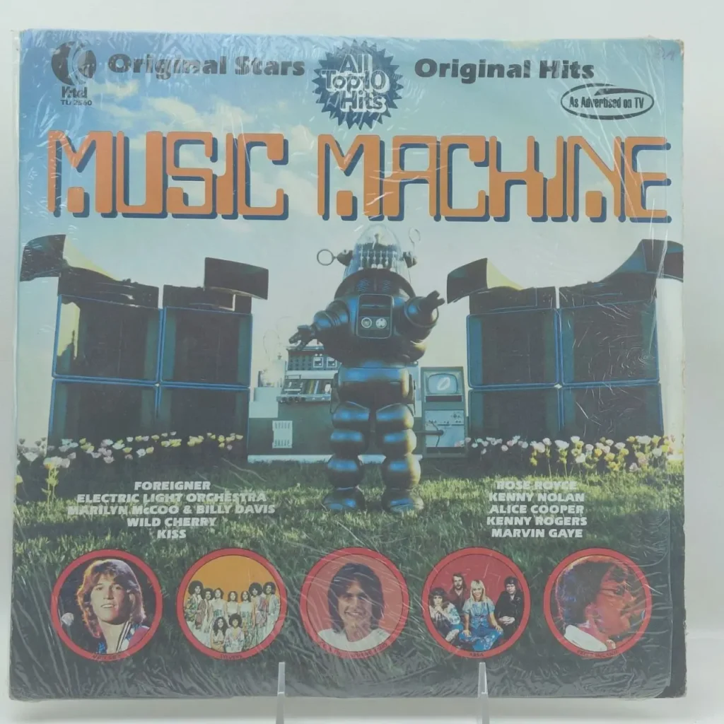 Álbum de vinilo K-Tel Music Machine con robot, altavoces y fotos de artistas como Foreigner, ELO, Kiss, by Remates Narvaja