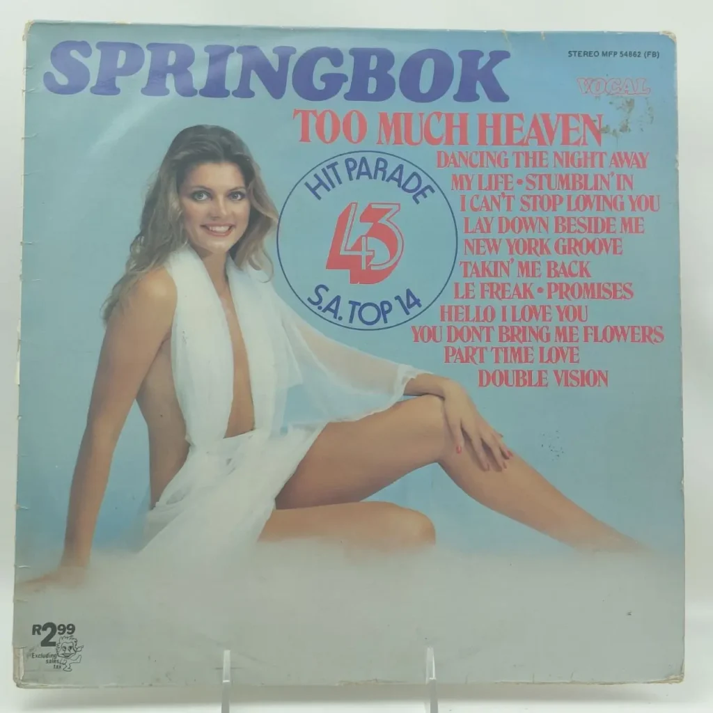 Portada del álbum de vinilo Springbok "Too Much Heaven" Hit Parade 43, con una mujer sonriente en una túnica blanca eté by Remates Narvaja