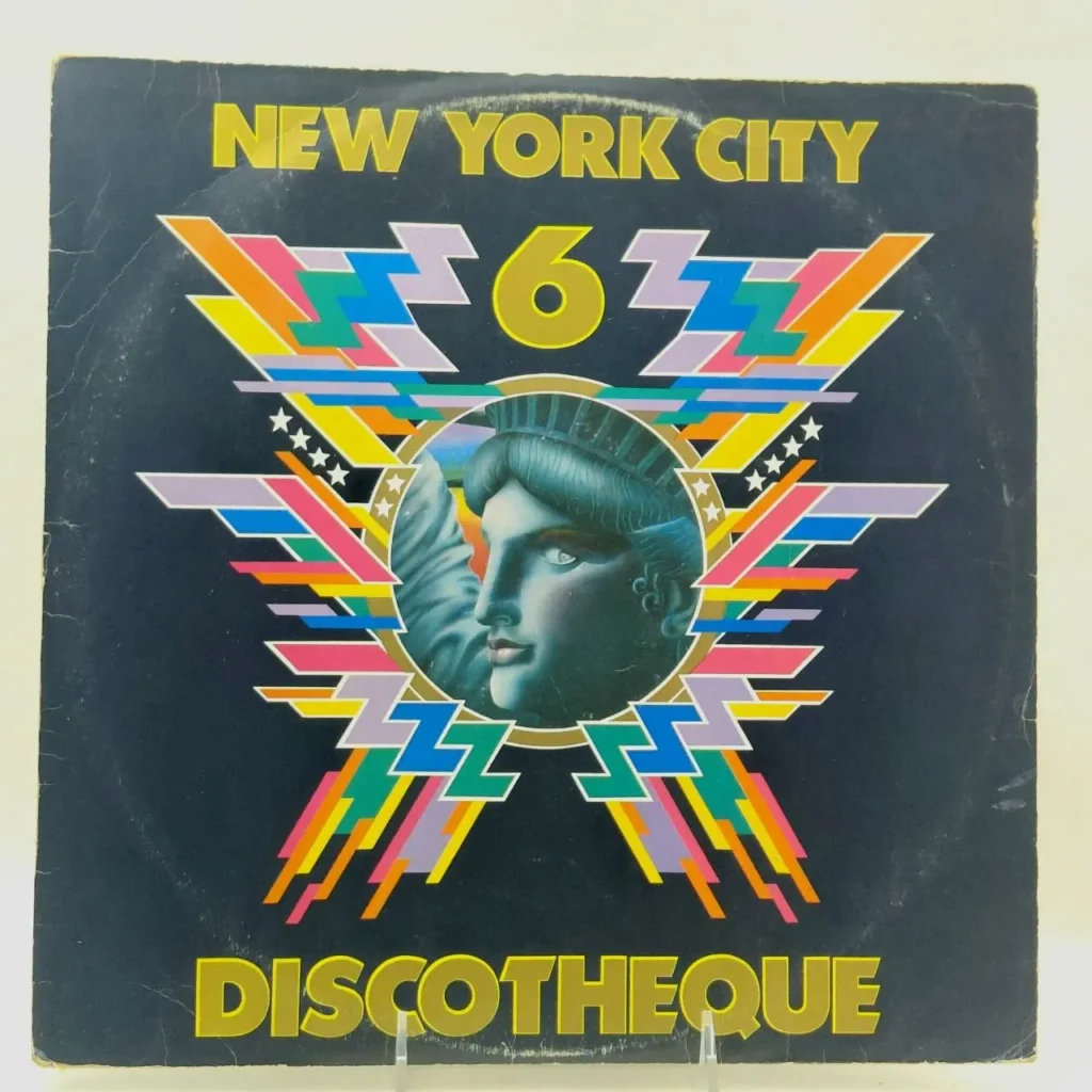 Portada de álbum New York City Discotheque 6 con la Estatua de la Libertad y diseño disco geométrico de colores vibrantes. by Remates Narvaja
