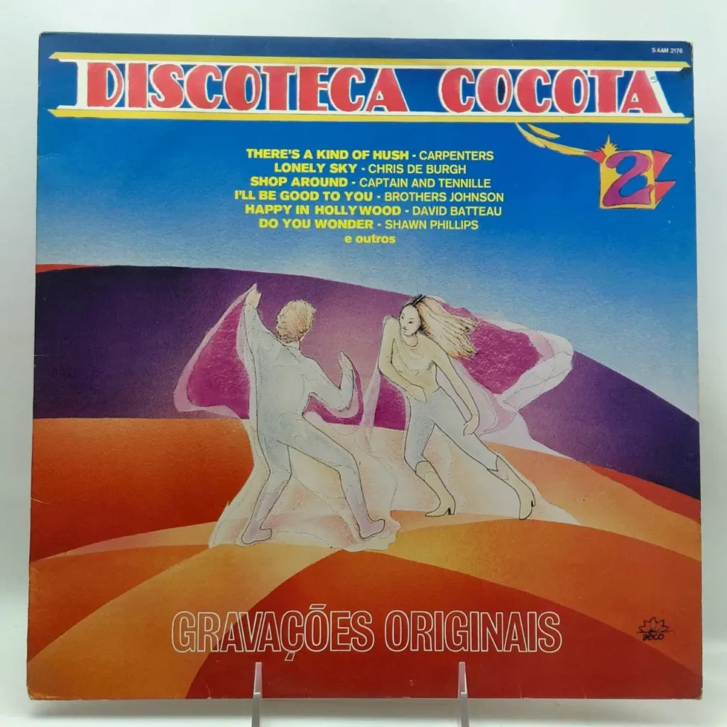 Portada de vinilo Discoteca Cocota 2 con ilustración de dos personas bailando en un paisaje vibrante, estilo disco. by Remates Narvaja