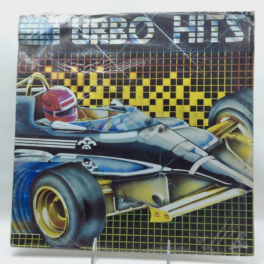 Álbum de música Turbo Hits con ilustración retro de coche de carreras y piloto, sellado. by Remates Narvaja