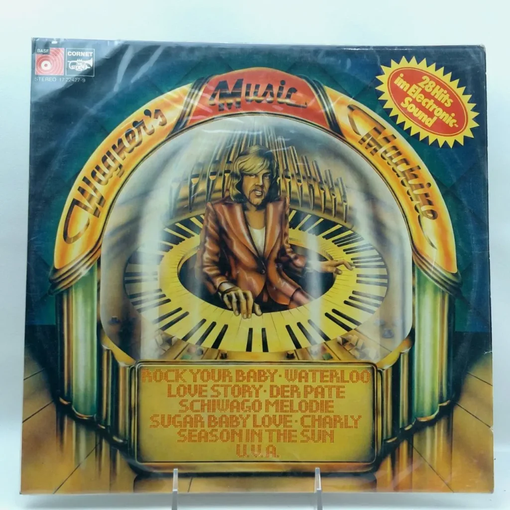 Portada de álbum de vinilo "Wagener's Music Machine" con un hombre tocando un teclado dentro de una máquina de música estilo jukebox, by Remates Narvaja