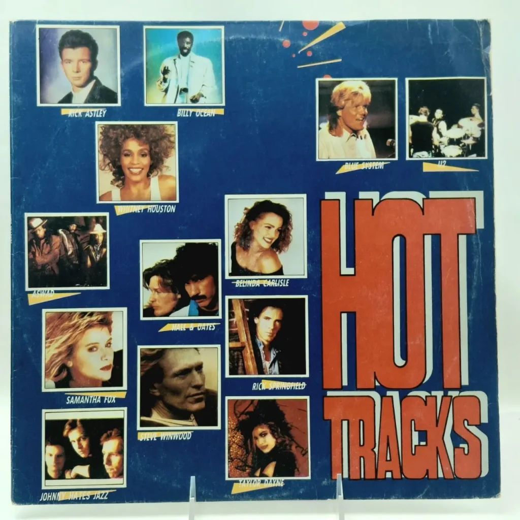Portada de álbum "Hot Tracks" con fotos de artistas pop de los 80 y 90 como Whitney Houston, Rick Astley, Billy by Remates Narvaja