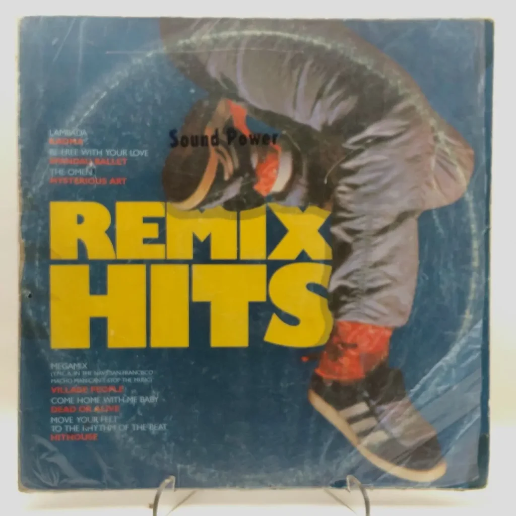 Portada del álbum "Remix Hits Sound Power" con piernas de bailarín en zapatillas y calcetines rojos sobre fondo azul. by Remates Narvaja