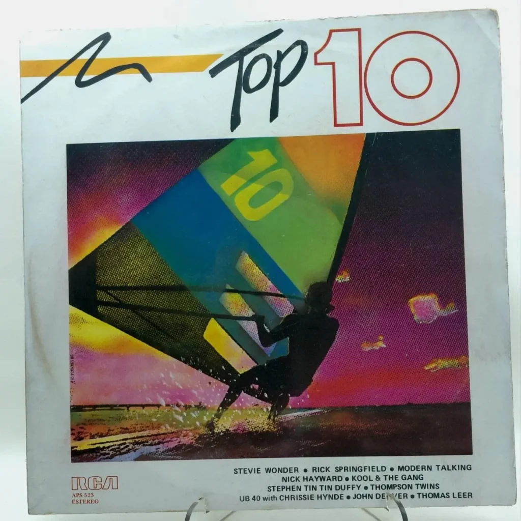 Portada de álbum Top 10 de los 80 con windsurfista y colores neón, incluye artistas como Stevie Wonder, Rick Springfield, Modern Talking by Remates Narvaja