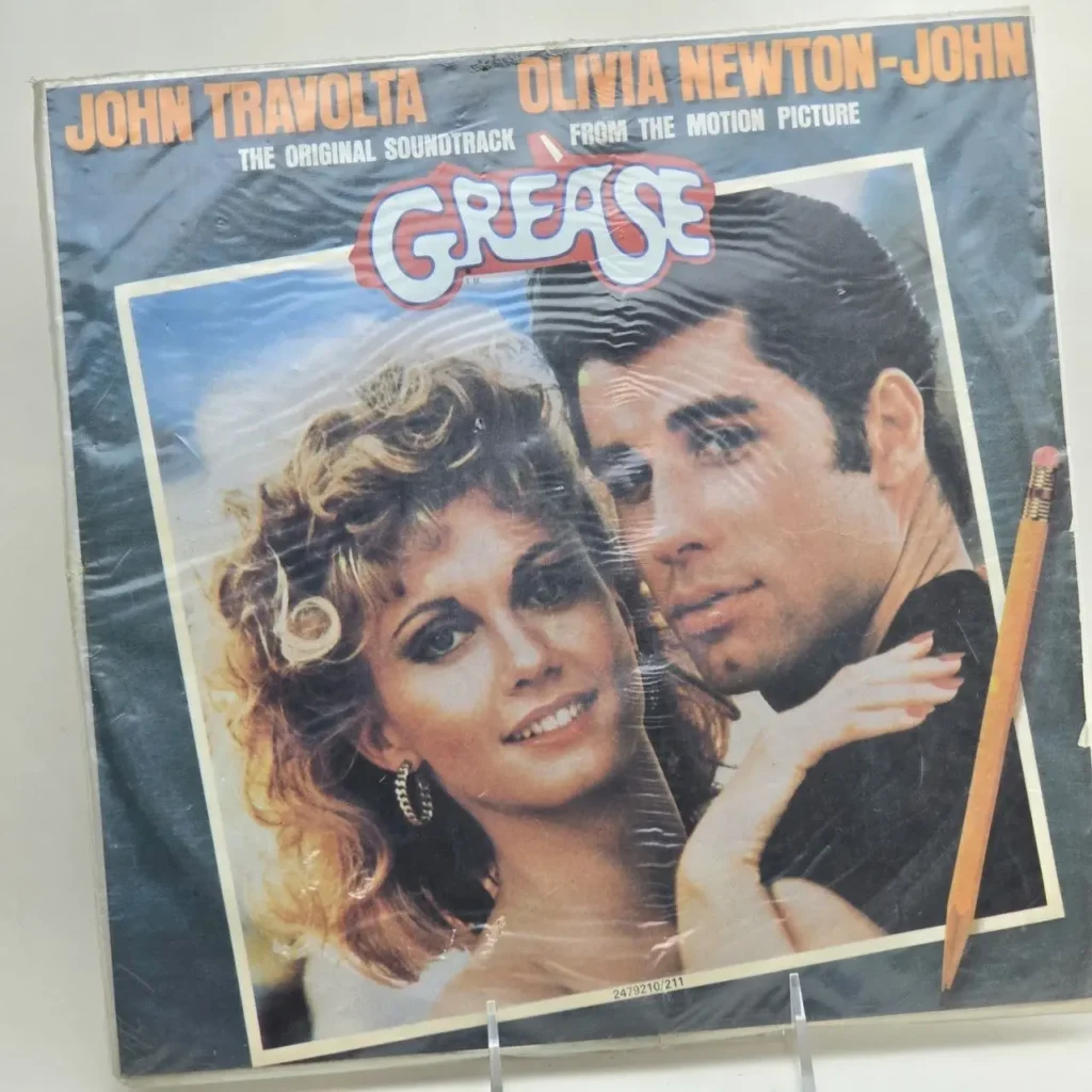 Portada del álbum Grease banda sonora con John Travolta y Olivia Newton-John, sellado en plástico. by Remates Narvaja