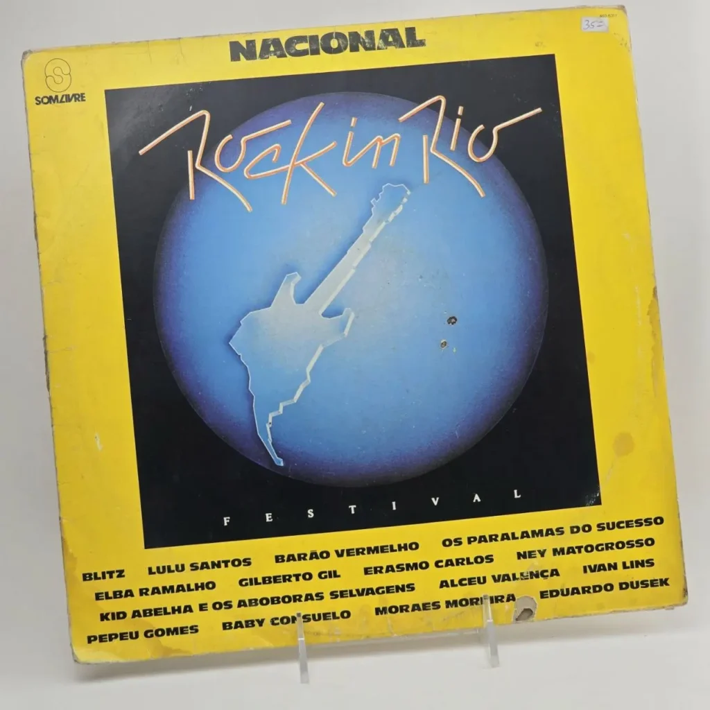 Carátula de vinilo Rock in Rio Festival Nacional con guitarra eléctrica sobre globo azul, listando artistas como Blitz, Lulu Santos, Barão Vermelho, by Remates Narvaja