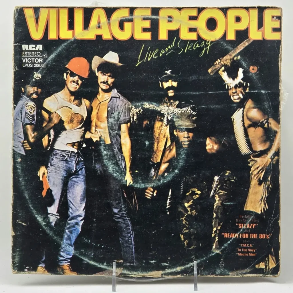 Portada del álbum "Village People Live and Sleazy" con los seis miembros en sus trajes icónicos. by Remates Narvaja