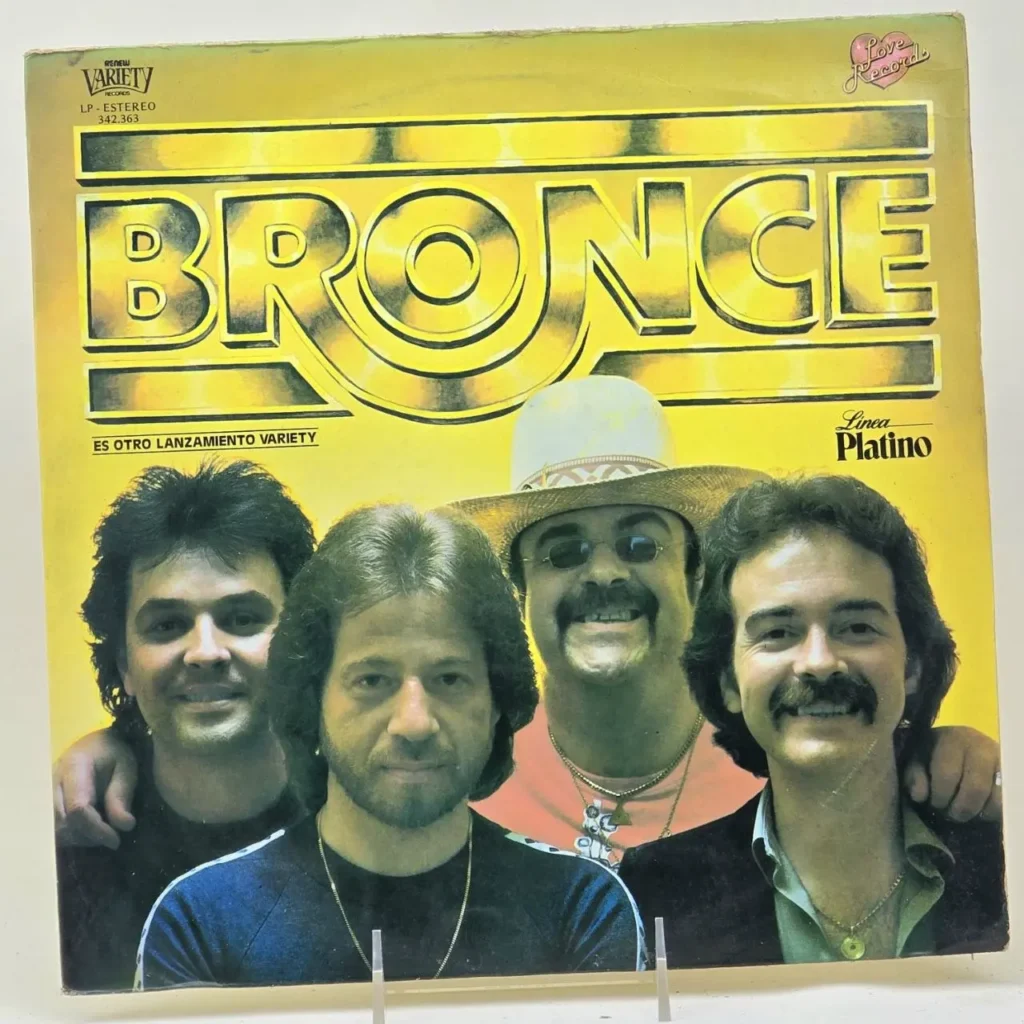 Portada de álbum Bronce con los cuatro miembros de la banda en un fondo amarillo, sello Variety Records. by Remates Narvaja