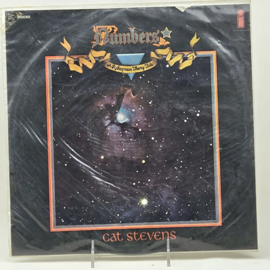 Portada de álbum de vinilo "Numbers" de Cat Stevens, con arte de espacio oscuro, estrellas, nebulosa y el subtítulo "A Pythagorean Theory by Remates Narvaja
