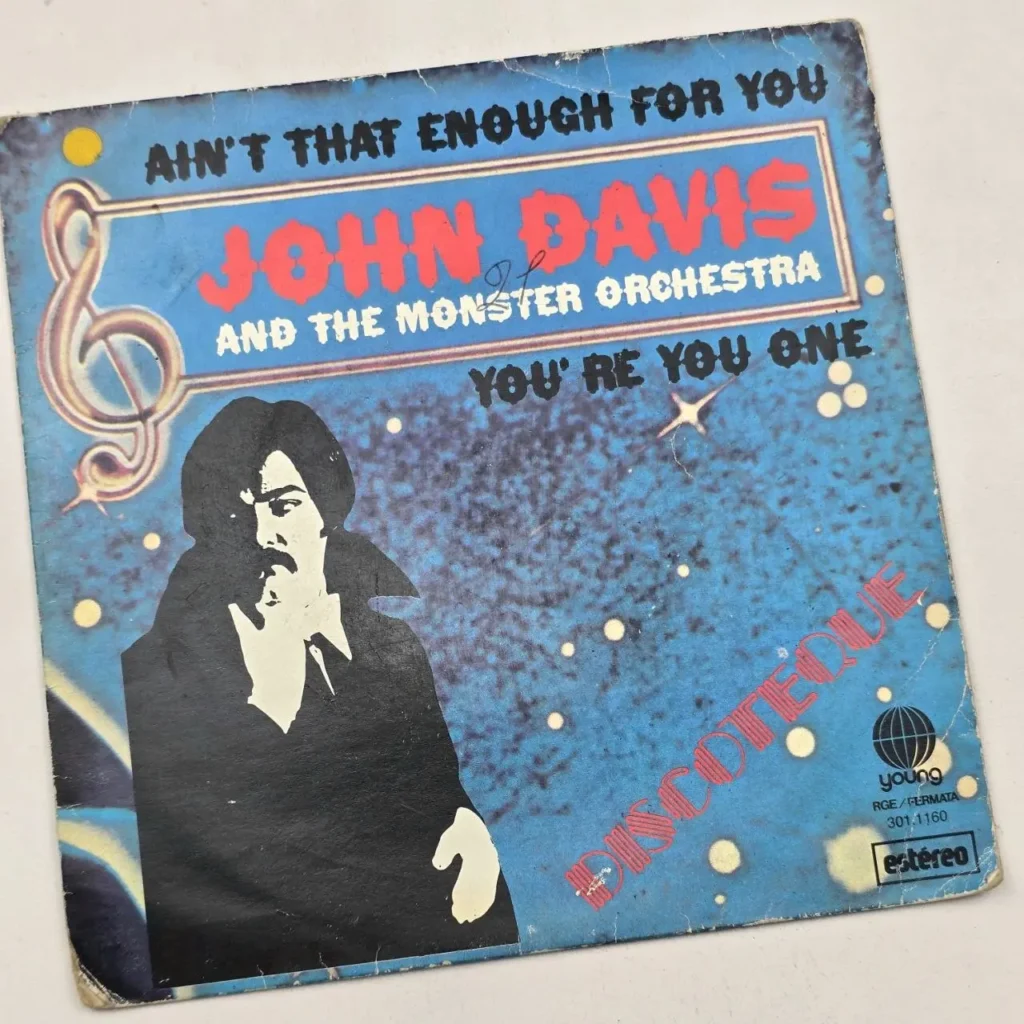 Portada de vinilo disco vintage de John Davis and The Monster Orchestra, con los temas "Ain't That Enough For You" y "You' by Remates Narvaja