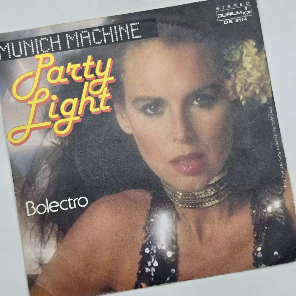 Portada de disco de vinilo Munich Machine - Party Light, con una mujer estilo disco y el texto Bolectro. by Remates Narvaja