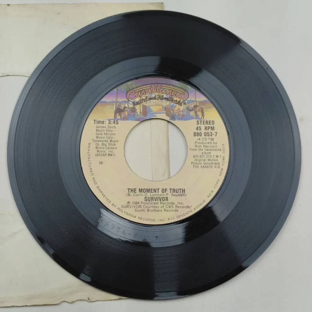 Disco de vinilo 45 RPM de Survivor, "The Moment of Truth", banda sonora de Karate Kid. by Remates Narvaja