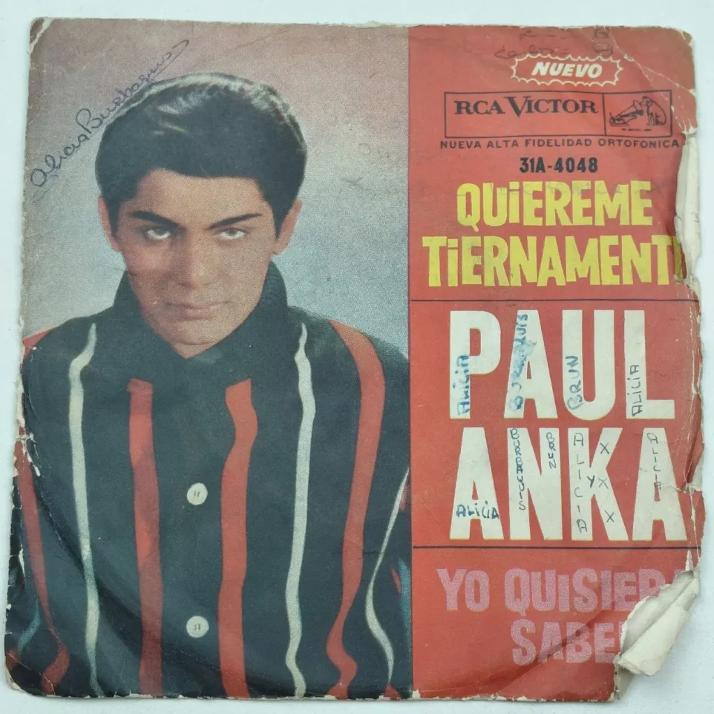 Portada de single Paul Anka "Quiéreme Tiernamente" RCA Victor, con foto del artista en camisa de rayas. by Remates Narvaja