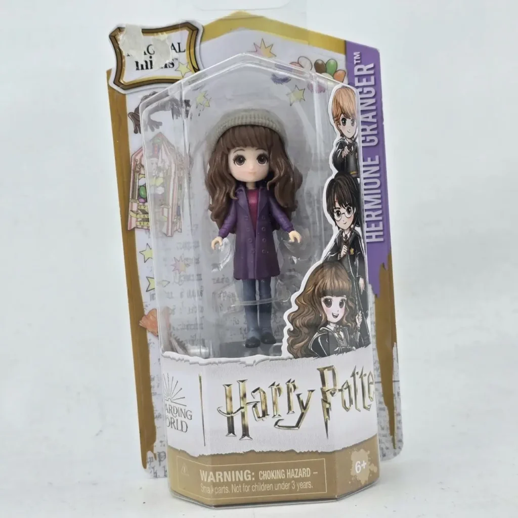Hermione Granger Magical Minis Harry Potter doll in purple coat and beanie, in original packaging. by Remates Narvaja