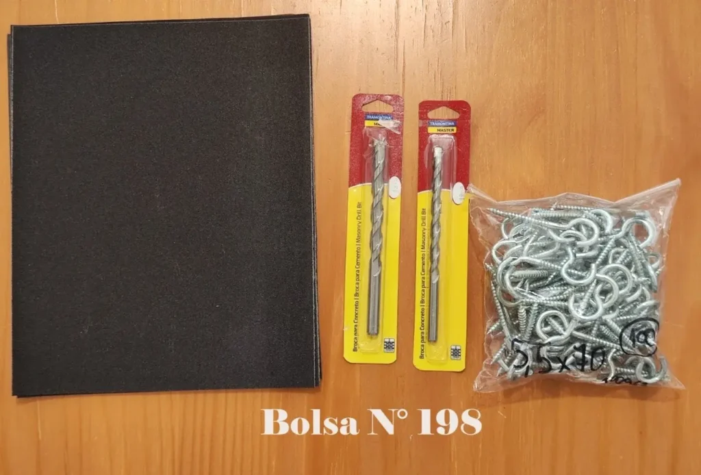 Bolsa N° 198 con dos brocas Tramontina para cemento, tornillos de ojo y láminas negras. by Remates Narvaja