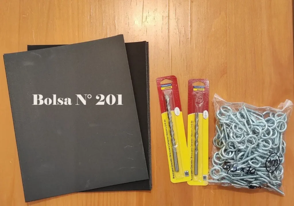 Bolsa N° 201 con brocas Tramontina para concreto y tornillos de ojo. by Remates Narvaja