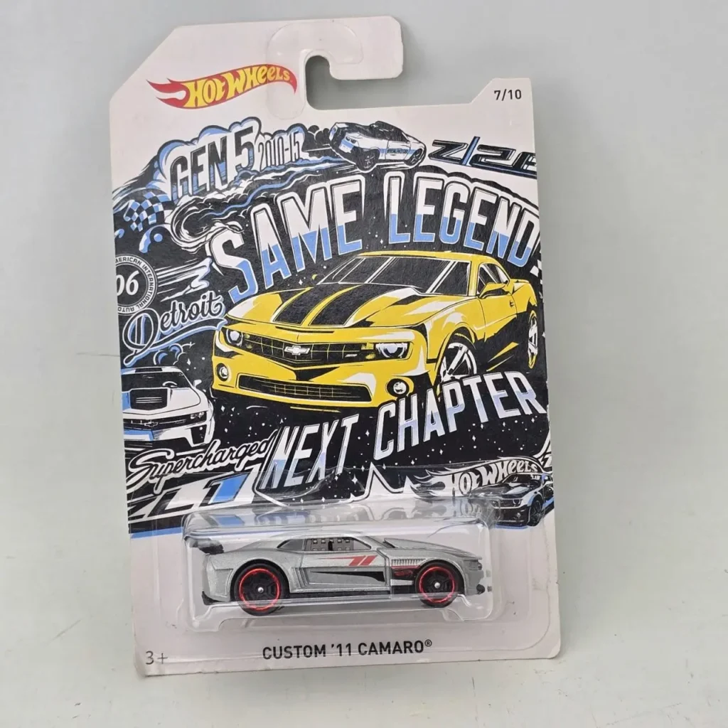 Hot Wheels Custom '11 Camaro die-cast car, silver, in packaging with yellow Camaro art and 'Same Legend Next Chapter' text. by Remates Narvaja