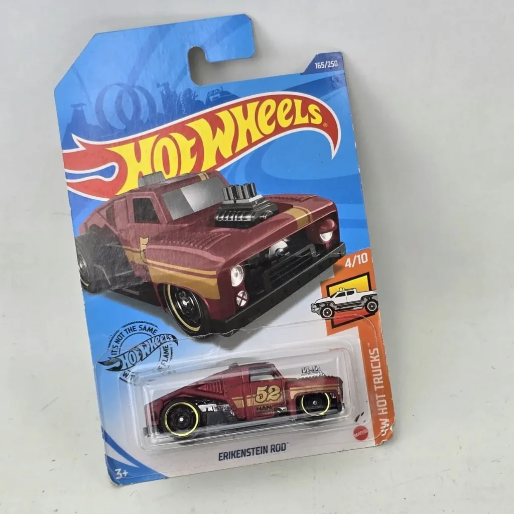 Hot Wheels Erikenstein Rod, camión die-cast color granate en su empaque original. by Remates Narvaja