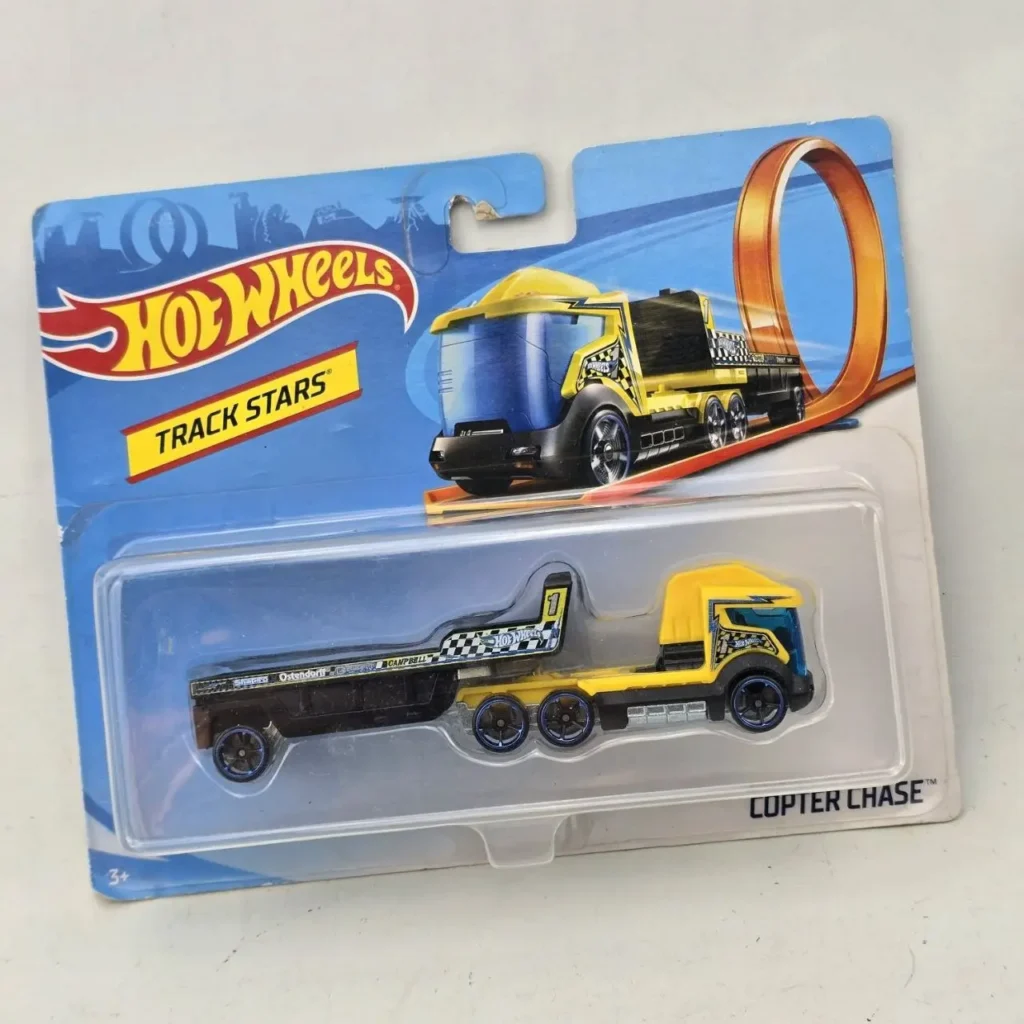 Hot Wheels Track Stars Copter Chase camión con remolque amarillo y negro en su empaque. by Remates Narvaja