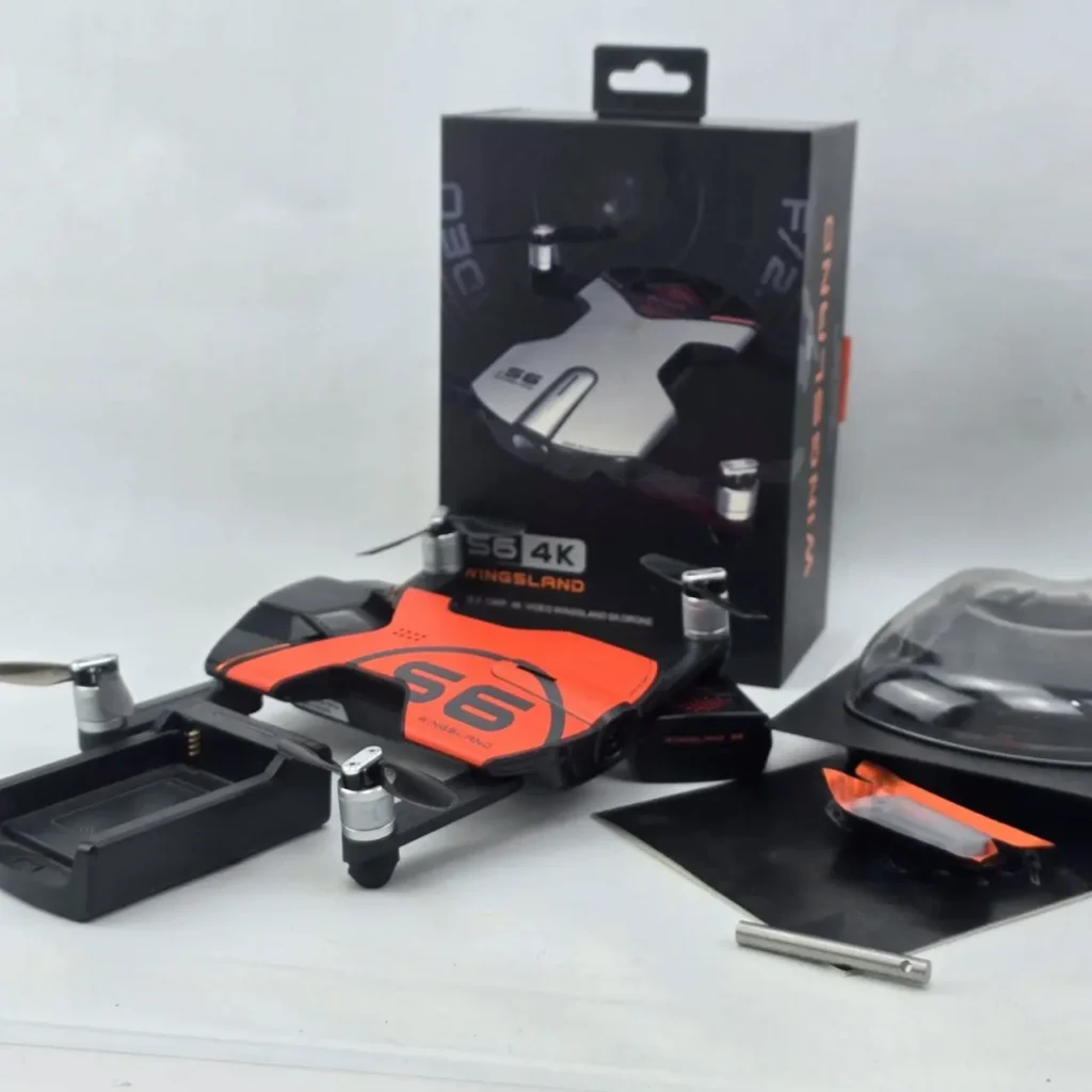 Dron Wingsland S6 4K plegable negro y naranja con su caja y accesorios. by Remates Narvaja