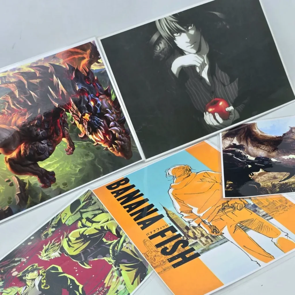 Colección de impresiones de arte de anime y videojuegos, incluyendo Death Note, Banana Fish y Monster Hunter. by Remates Narvaja